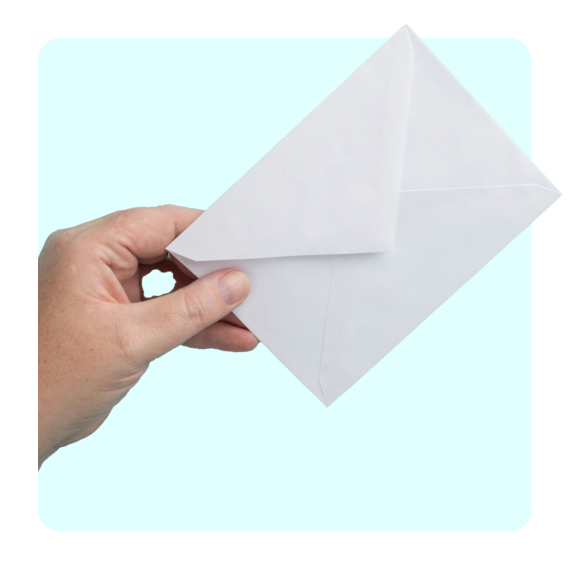 a hand holding an envelope